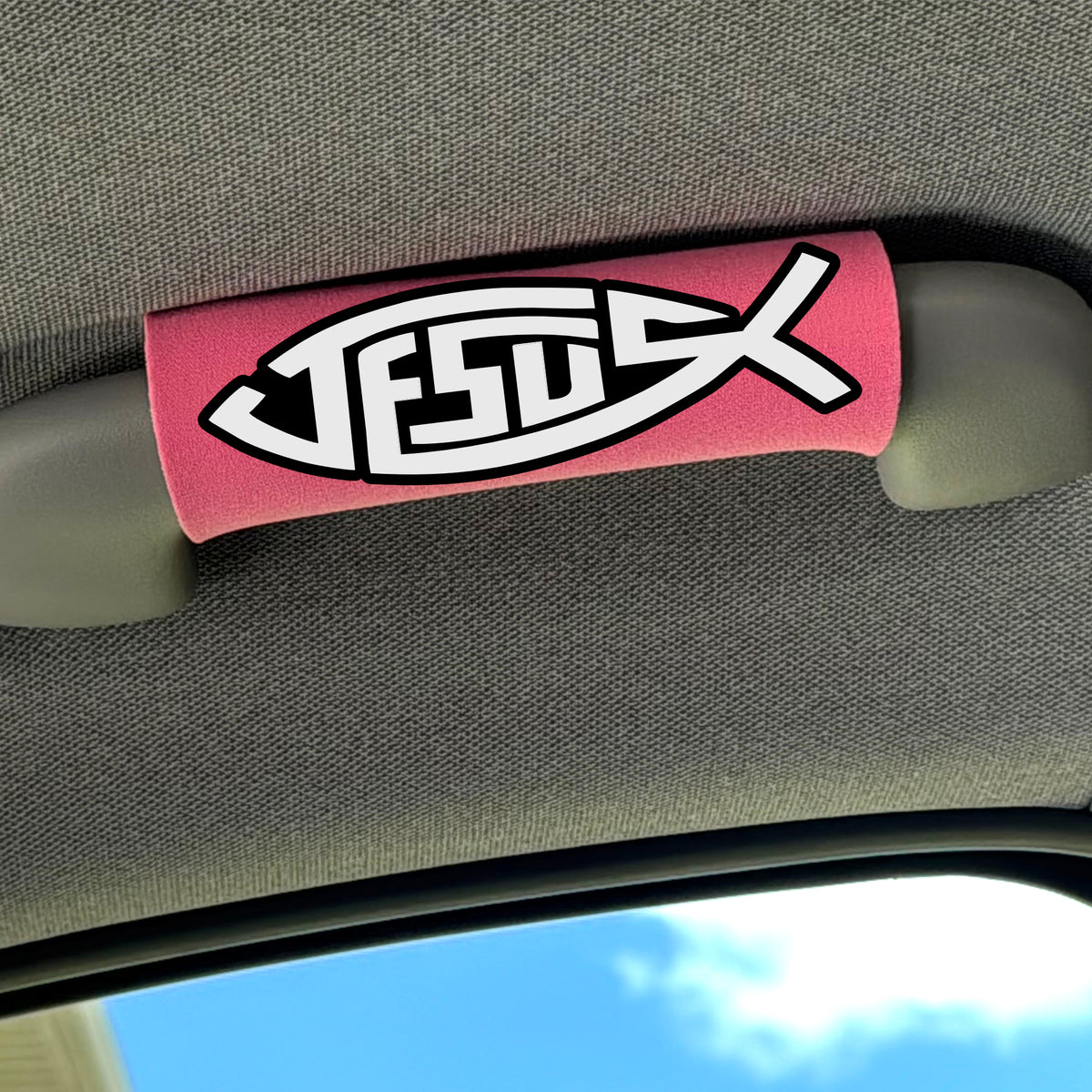 The Jesus Fish Grip installed on a vehicle interior grab handle